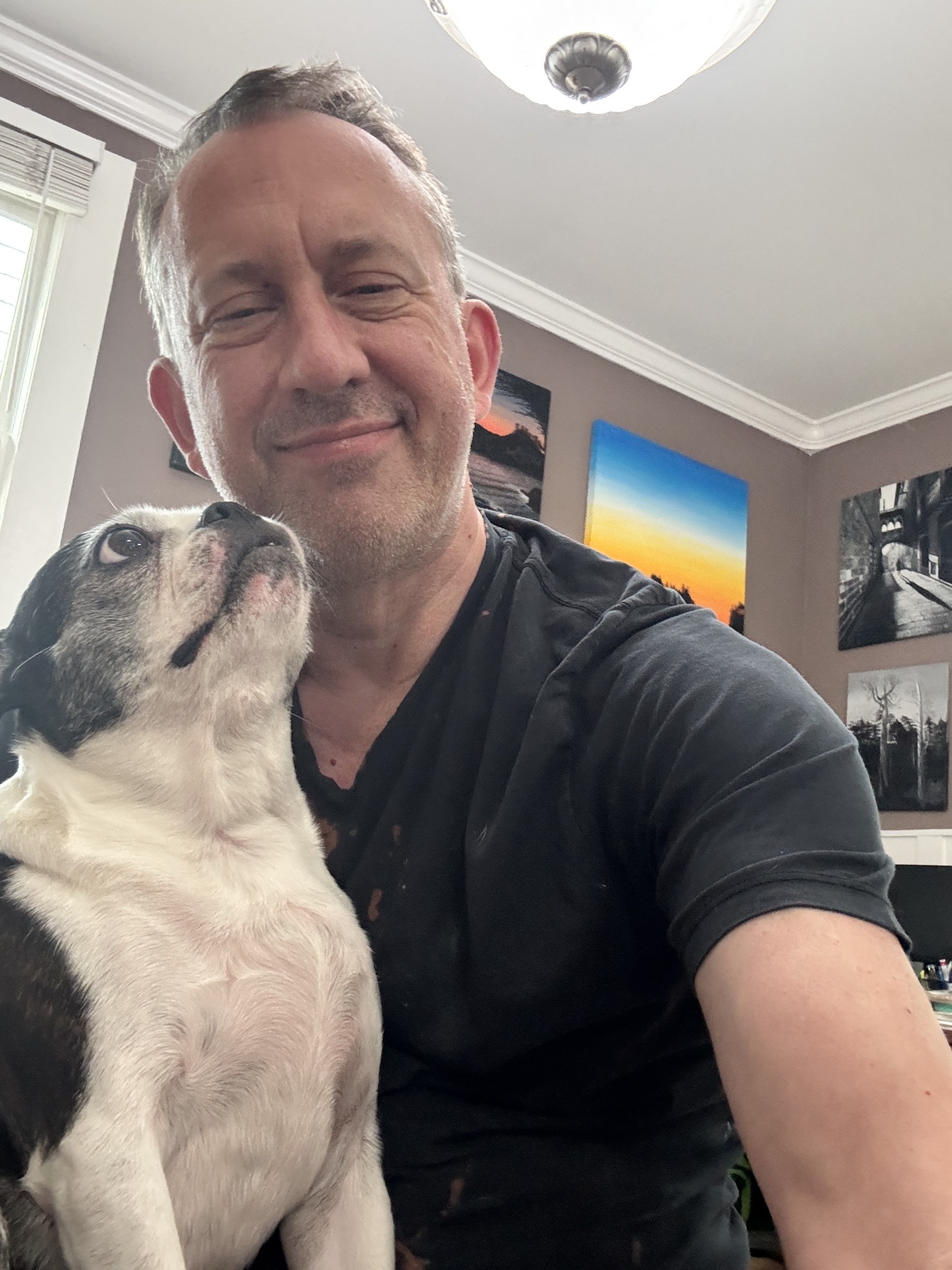 Felice Mazzoni at home with his dog