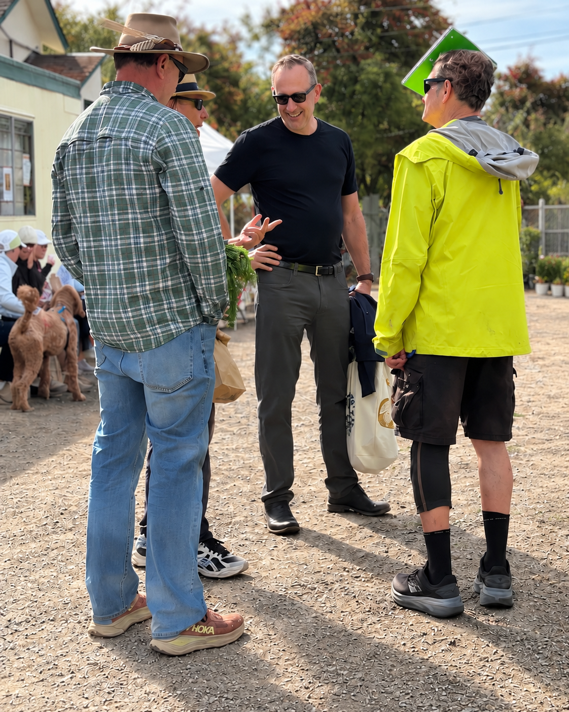 Felice Mazzoni speaking with residents at a community gathering