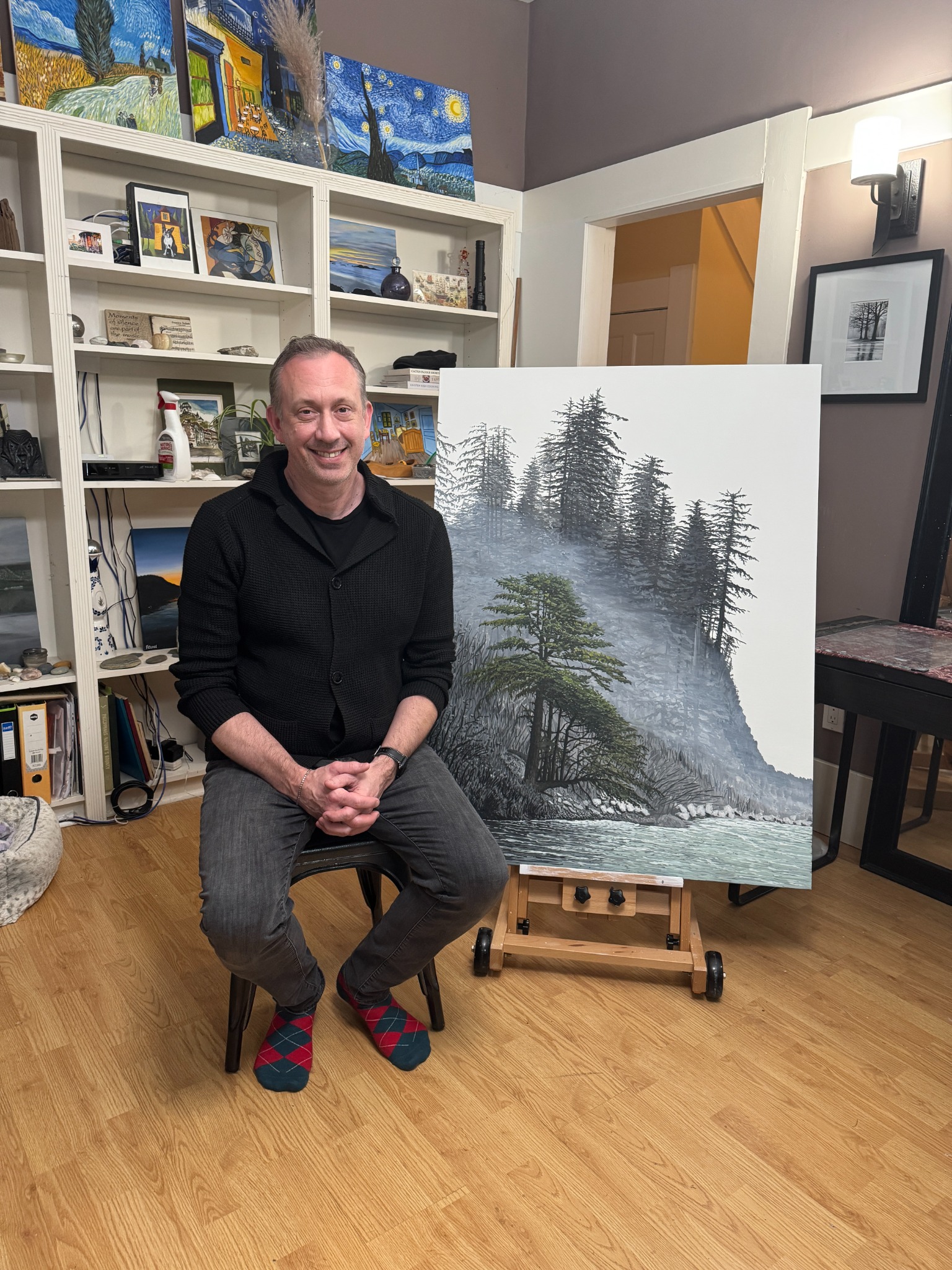 Felice Mazzoni beside one of his west coast paintings